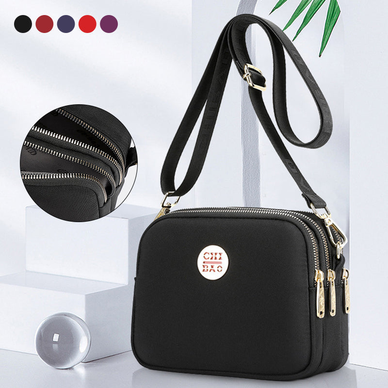 Funksjonell nylon messengerbag for kvinner, perfekt hverdagsveske med god plass.