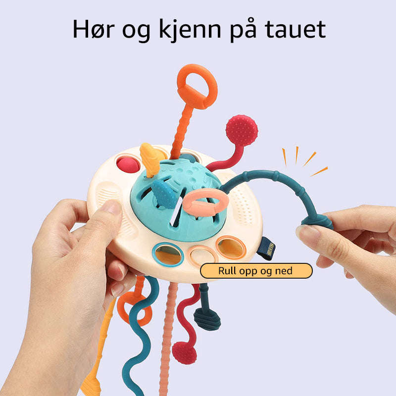 Fargerikt UFO-formet silikonleketøy som fanger babyens oppmerksomhet og stimulerer synet.