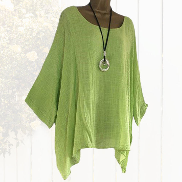 Kvinner elegant bluse med flaggermusermer, løs passform og rund hals. Komfortabel topp for vår og sommer.
