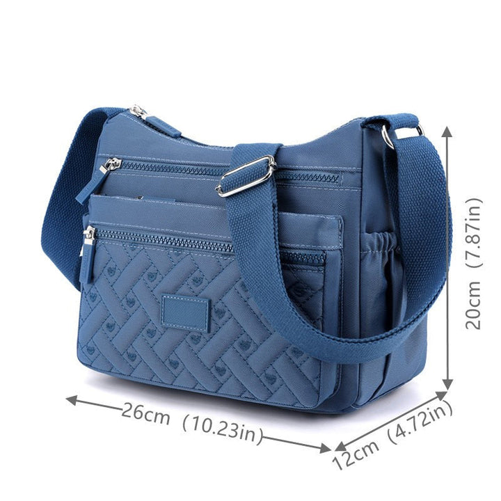 Komfortabel og stilfull dame messenger bag for travelt bruk og pendling.