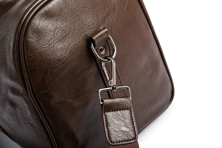 Svart reiseveske i PU-skinn, en duffelveske for menn med elegant design og robust konstruksjon.