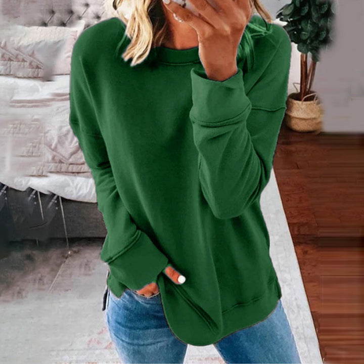 Elegant, ensfarget langermet damebluse for en stilfull og komfortabel hverdag.