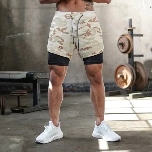 Elastisk linning og snøring på Herre 2-i-1 treningsshorts sikrer perfekt passform og komfort under intens herretrening.