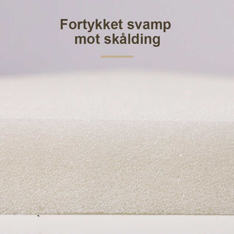 Ergonomisk damphanske med varmebeskyttelse for trygg og enkel stryking. Perfekt husholdningsutstyr.
