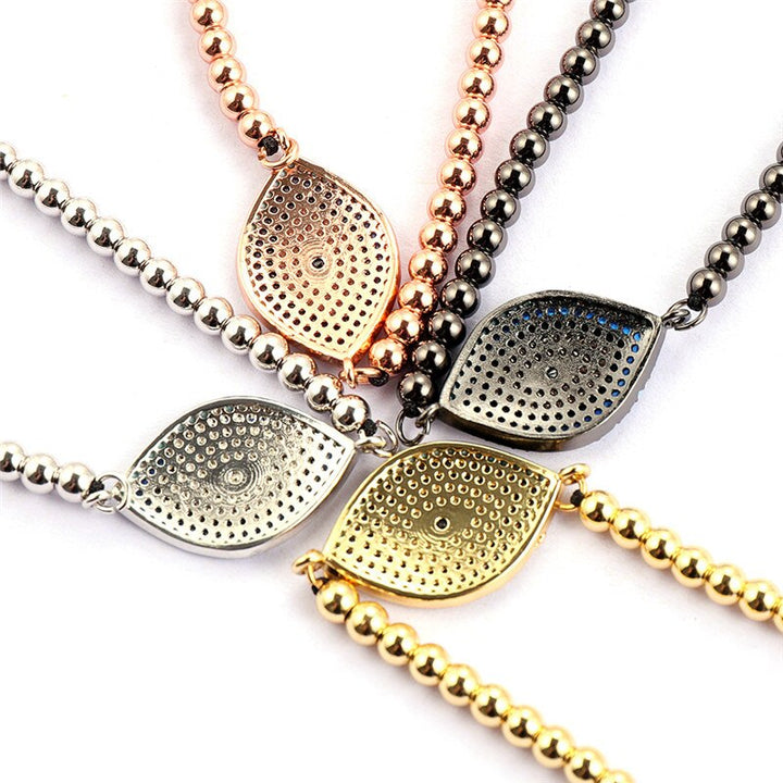 Rose gull onde øye armbånd med skinnende Cubic Zirconia. Trendy og beskyttende dame armbånd, justerbart.