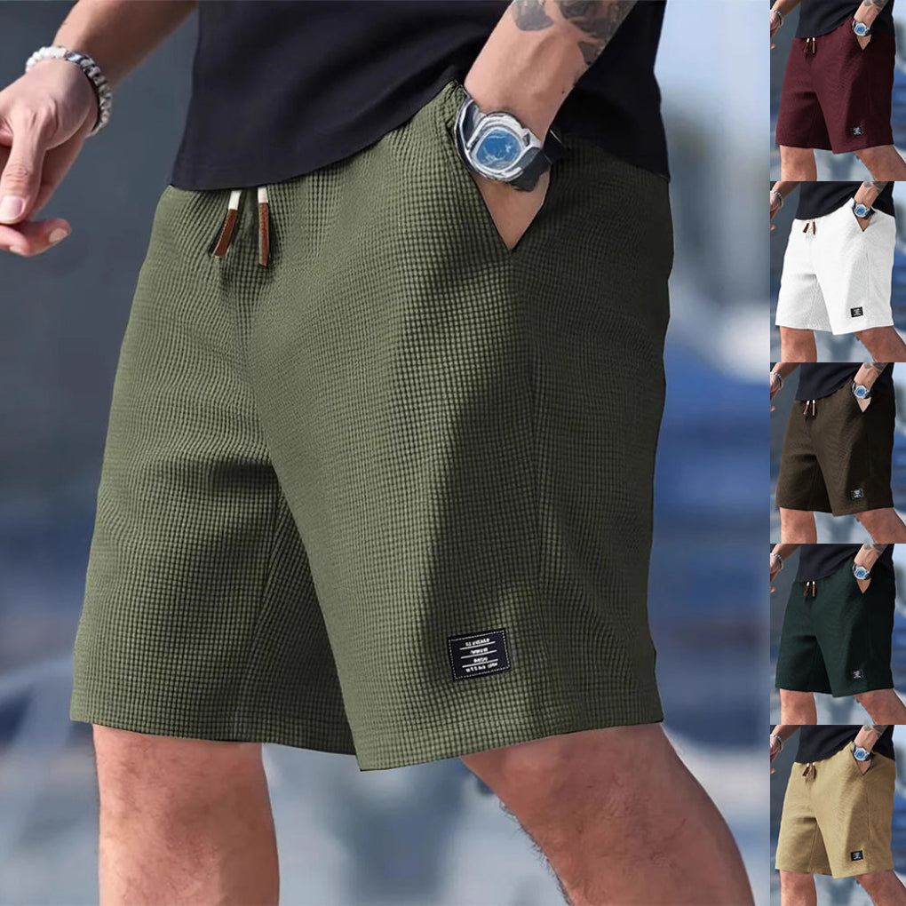 Menns komfortable sportsshorts med snøring, perfekt for hverdag og trening. Løs passform med lommer for sportsklær.