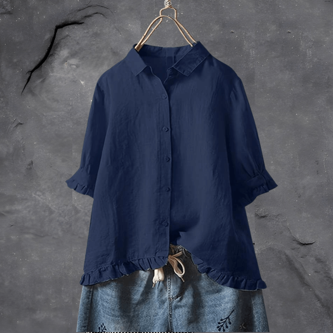 Elegant ensfarget dameskjorte i polyester med knappeserie. Løs passform for vår/sommer mote.