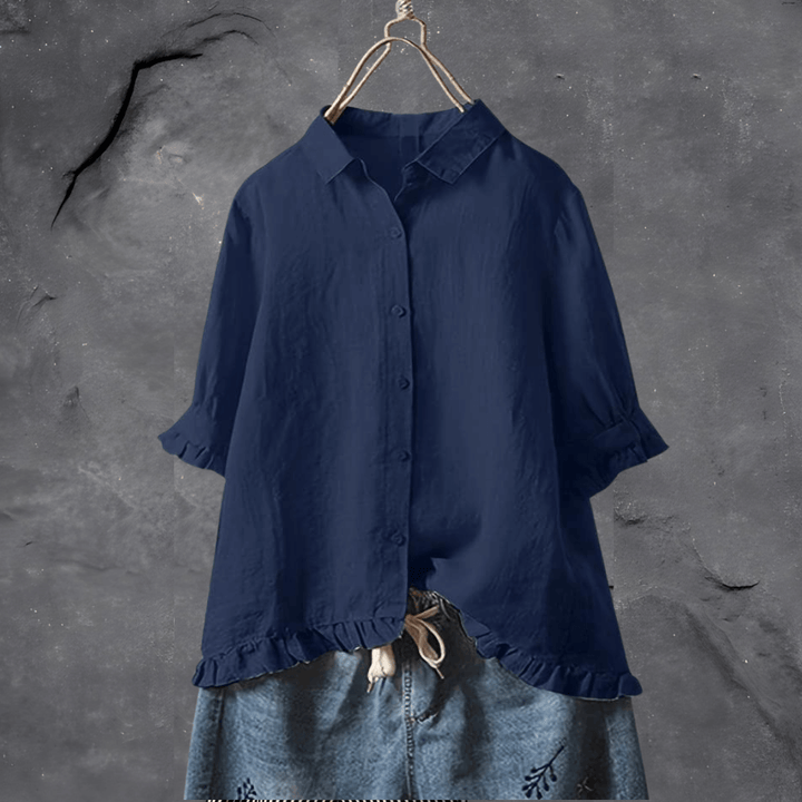 Elegant ensfarget dameskjorte i polyester med knappeserie. Løs passform for vår/sommer mote.