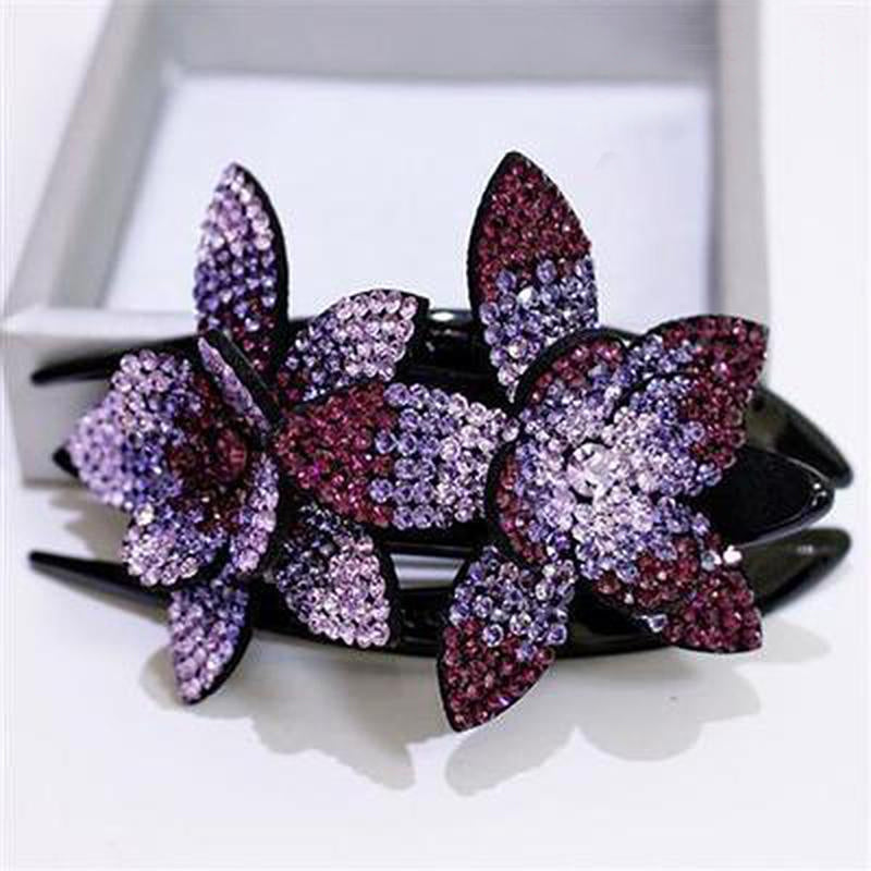 Glitrende hårpynt: hårklemme for kvinner med doble rhinesteinblomster, perfekt for en chic frisyre.