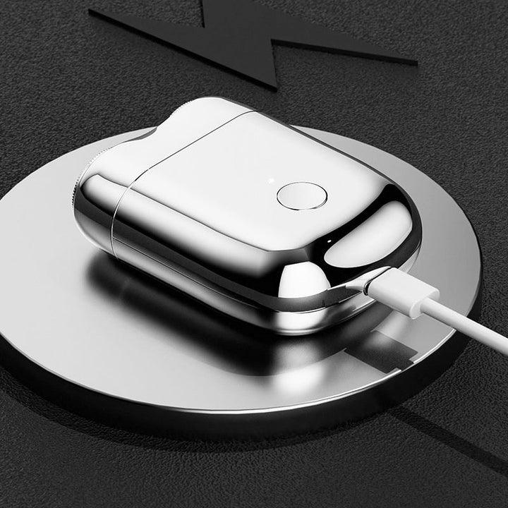 Blå vanntett USB barbermaskin for menn. Bærbar design gjør den ideell for reise og daglig personligpleie.