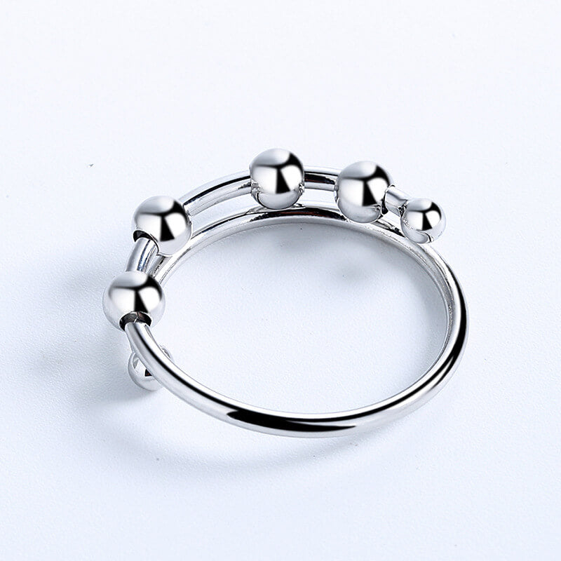 Beroligende justerbar dame fidget-ring, sølvfarget smykke, klar til å lindre angst og stress.