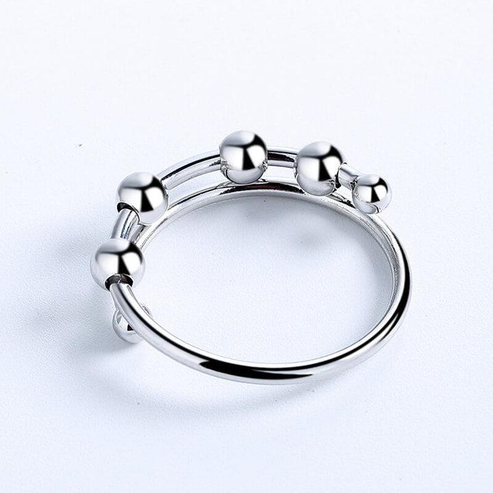 Beroligende justerbar dame fidget-ring, sølvfarget smykke, klar til å lindre angst og stress.