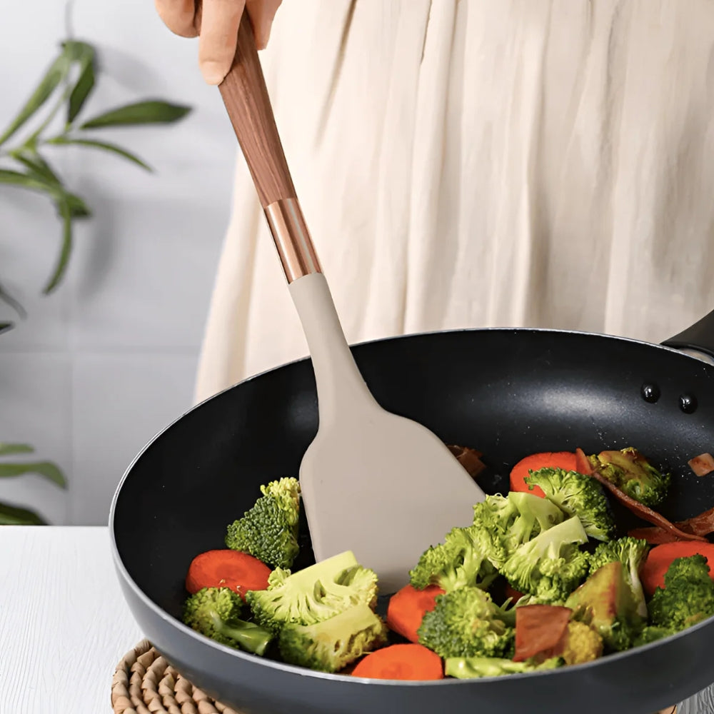 Varmebestandig og non-stick silikon kokeredskap, del av et 10-dels sett for allsidig bruk.