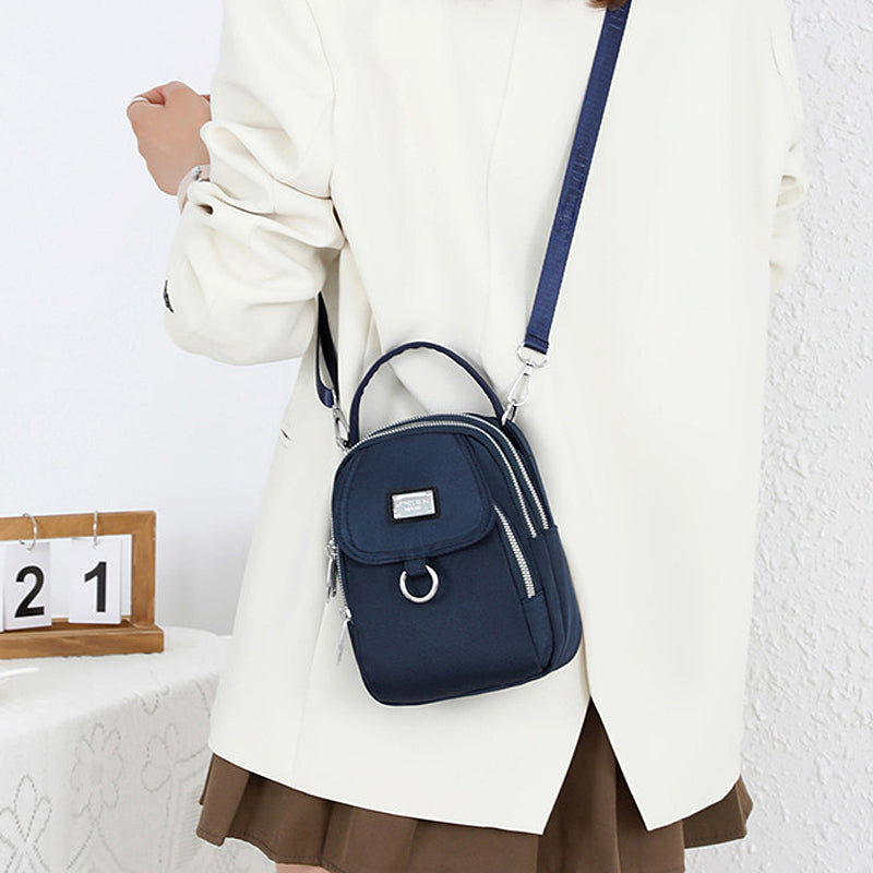 Fargerik og funksjonell vanntett crossbody-veske for kvinner. Ideell hverdagsveske.