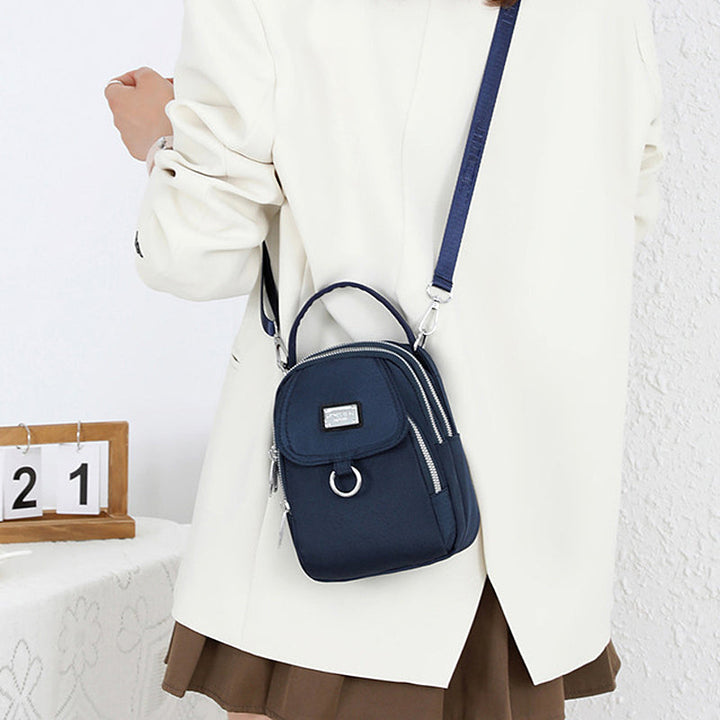 Fargerik og funksjonell vanntett crossbody-veske for kvinner. Ideell hverdagsveske.
