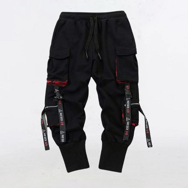 Detaljert bilde av unisex sort joggebukse med stropper; moderne streetwear-design.
