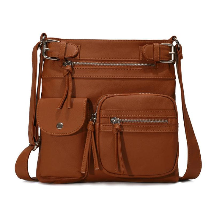 Funksjonell vanntett crossbody-veske for dame, med justerbar skulderrem og romslig design for behov.