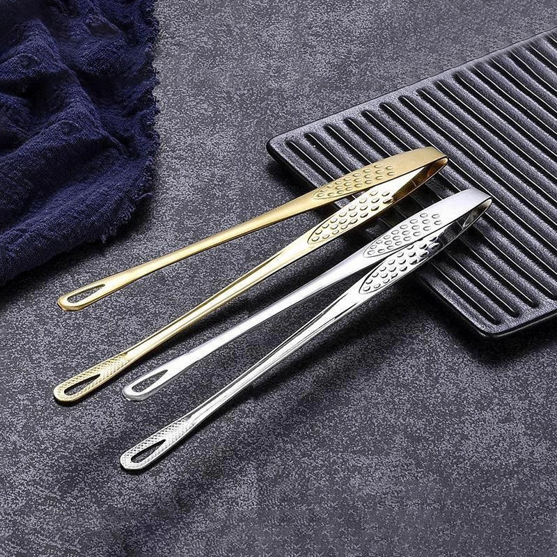 Elegant og funksjonell grilltang i rustfritt stål, et must for moderne kjøkken.