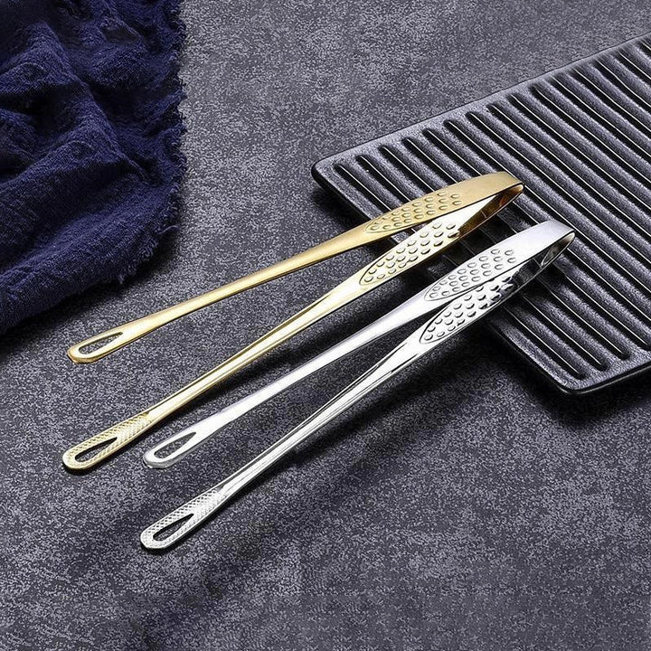 Elegant og funksjonell grilltang i rustfritt stål, et must for moderne kjøkken.