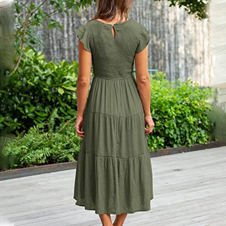 Dame volangkjole, elegant midi lengde, komfortabel bomullsblanding. Perfekt ensfarget A-linje sommerkjole.