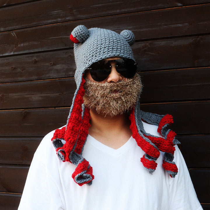 Nærbilde av blekksprutluens øyne og tentakler, viser den kreative heklede detaljen.