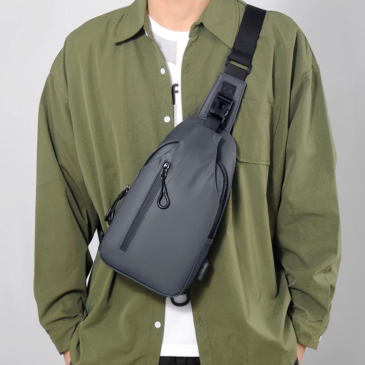 Allsidig unisex skulderveske/crossbody. Passer til herre og dame, vanntett og med USB.