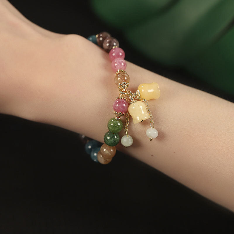 Håndlaget fargerikt turmalin armbånd med ekte natursteinperler. Kvalitetstilbehør.