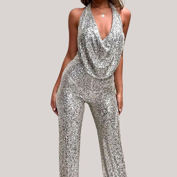 Langbeinet damejumpsuit med dyp V-hals og all-over glitter, ideell for en stilig festkveld.
