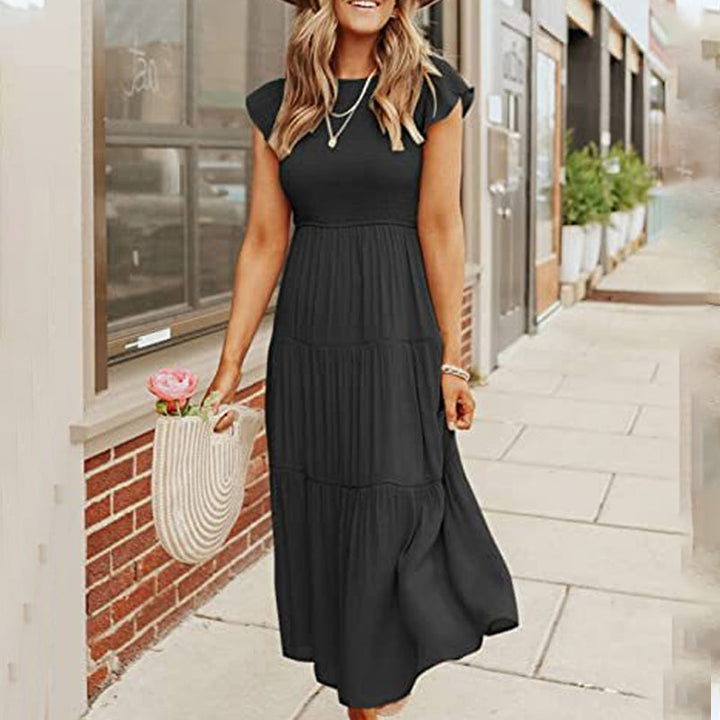 Elegant sommerkjole for kvinner. Komfortabel midikjole med volanger for fest og hverdag.