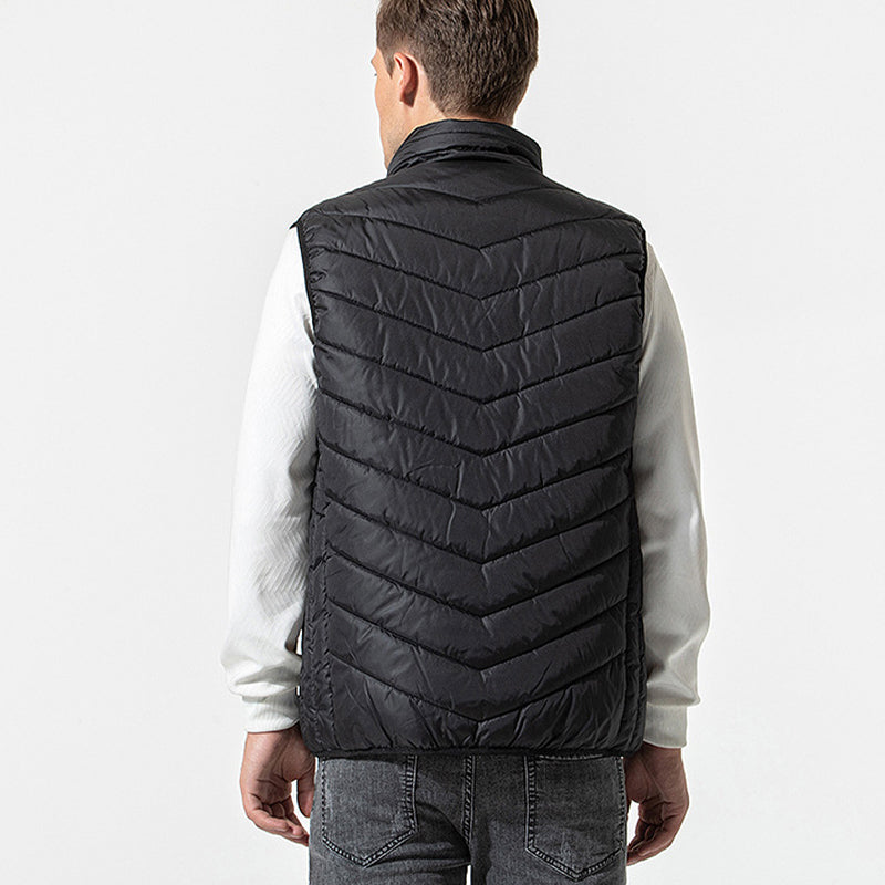Blå elektrisk varmevest, lett og komfortabel for friluftsliv og turer. Unisex.