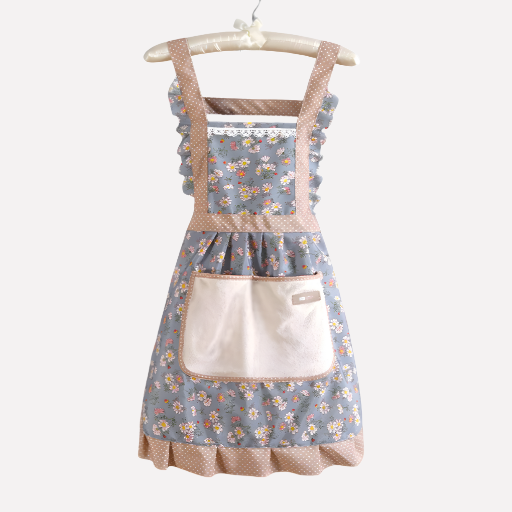 Elegant blomstret kjøkkenforkle med fargerikt blomstermønster, perfekt for matlaging og baking i hjemmekjøkkenet.