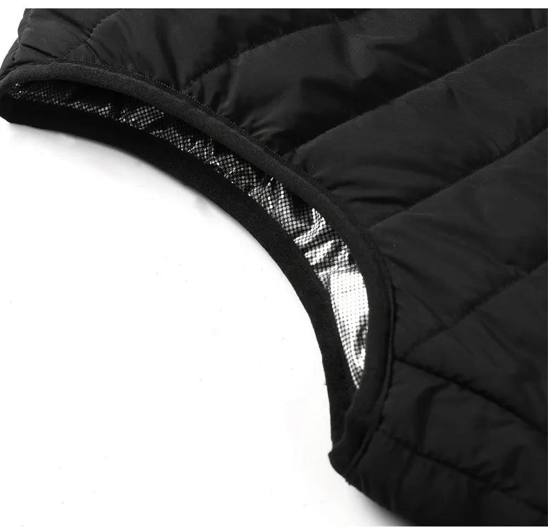 Stilig oppvarmet vest i mørk farge, egnet som klesplagg og varmegenser. Perfekt for kalde eventyr.