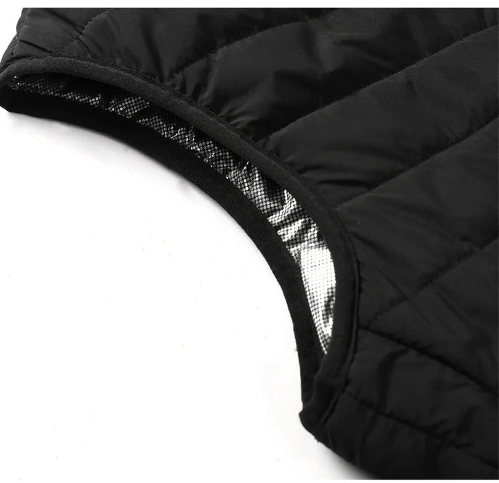 Stilig oppvarmet vest i mørk farge, egnet som klesplagg og varmegenser. Perfekt for kalde eventyr.