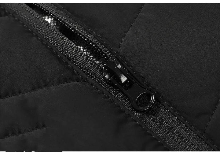 Komfortabel oppvarmet unisex vest, et must for vinterklær og friluftsliv. Gir langvarig varme.