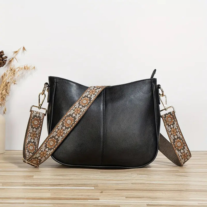 Bærekraftig dame skulderveske i vegansk PU-lær. Stilfull crossbody med justerbar reim for optimal komfort.