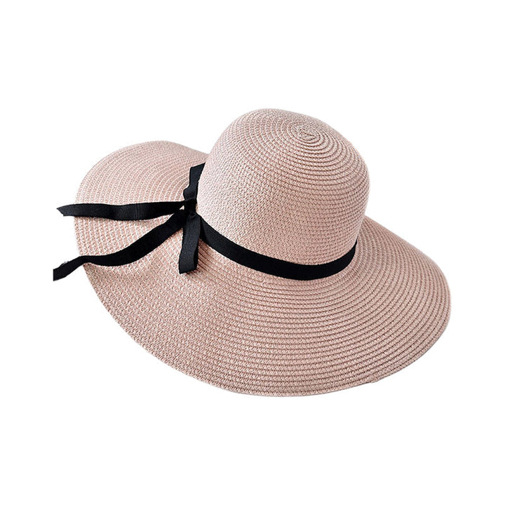 Trendy solhatt med bred kant, et must-have tilbehør for dame med god solbeskyttelse.