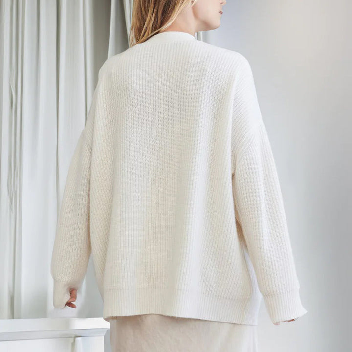 Vår/høst cardigan for kvinner, ensfarget og langermet med praktiske lommer.