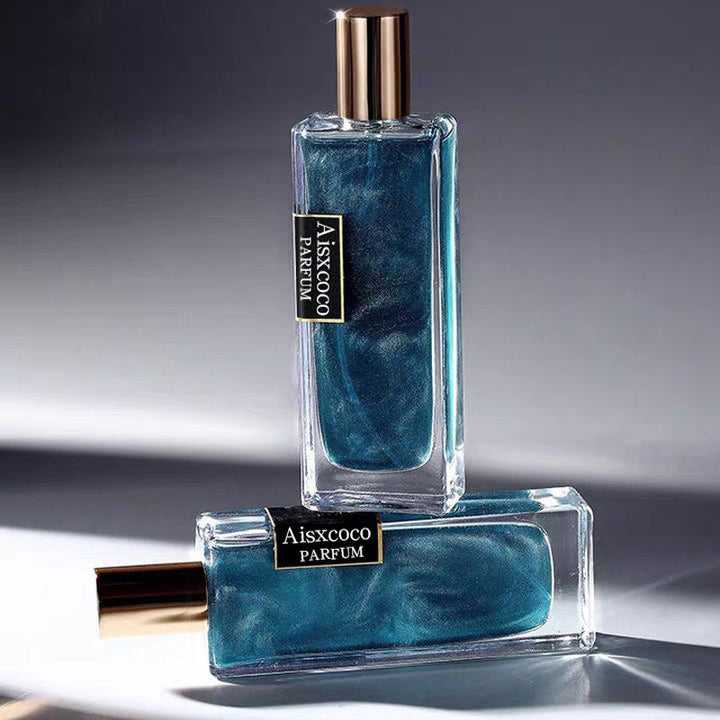 Elegant forgylt unisex parfymeflaske med strålende, langvarig duft for alle kjønn.