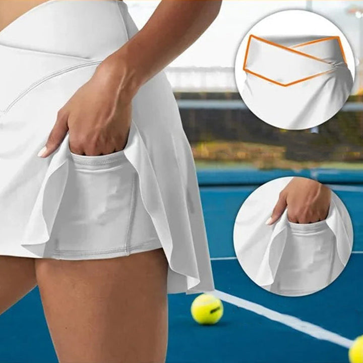Høymidje tennisskjørt til kvinner, laget i stretchy stoff for optimal bevegelsesfrihet under sport.