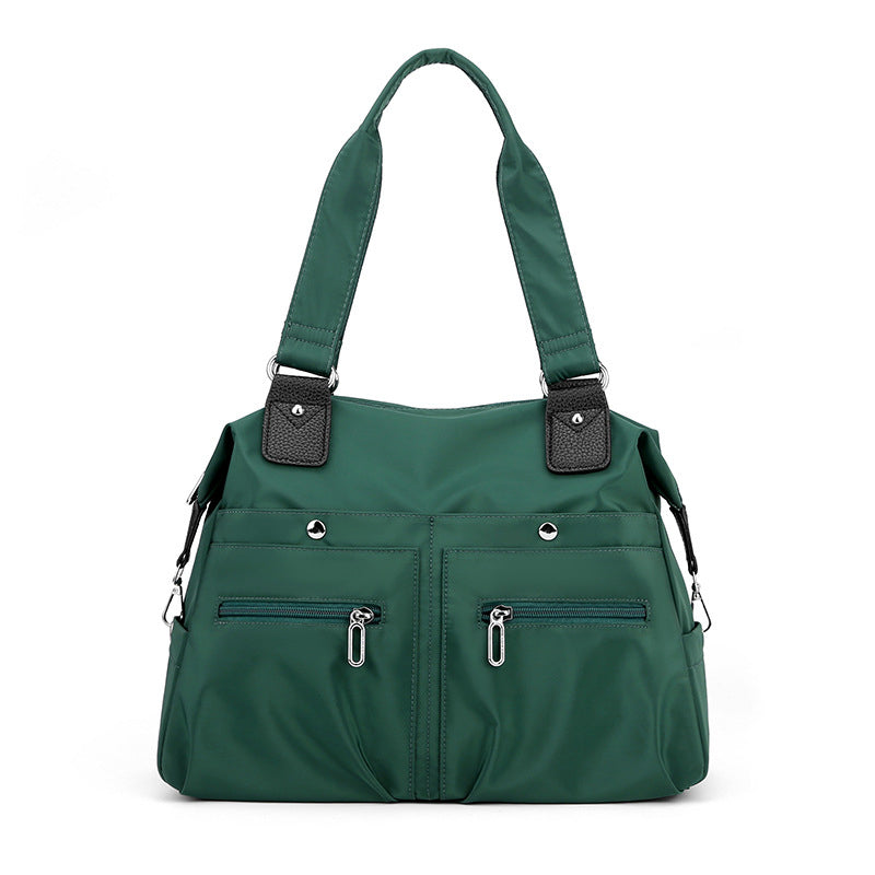 Vanntett nylon skulderveske for kvinner. Ideell laptopveske, reiseveske og arbeidsveske.