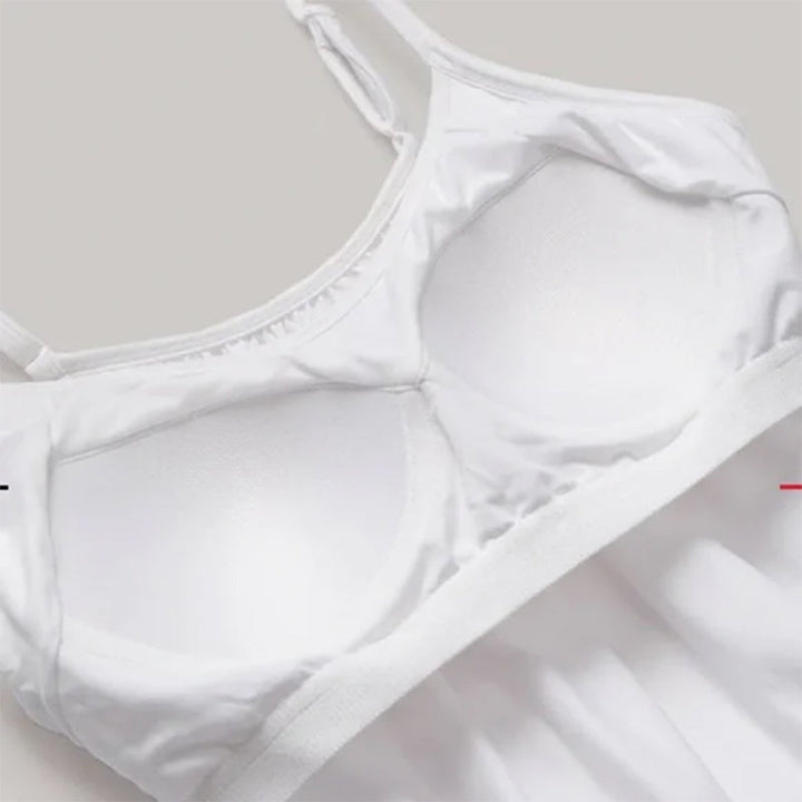 Dame basictopp: Løstsittende tank top med innebygd BH. Enkel, komfortabel og funksjonell kvinne topp.