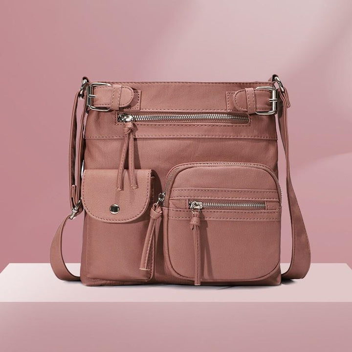 Stilfull dame crossbody-veske i vanntett PU-lær, perfekt for hverdag, reise og praktisk bruk.