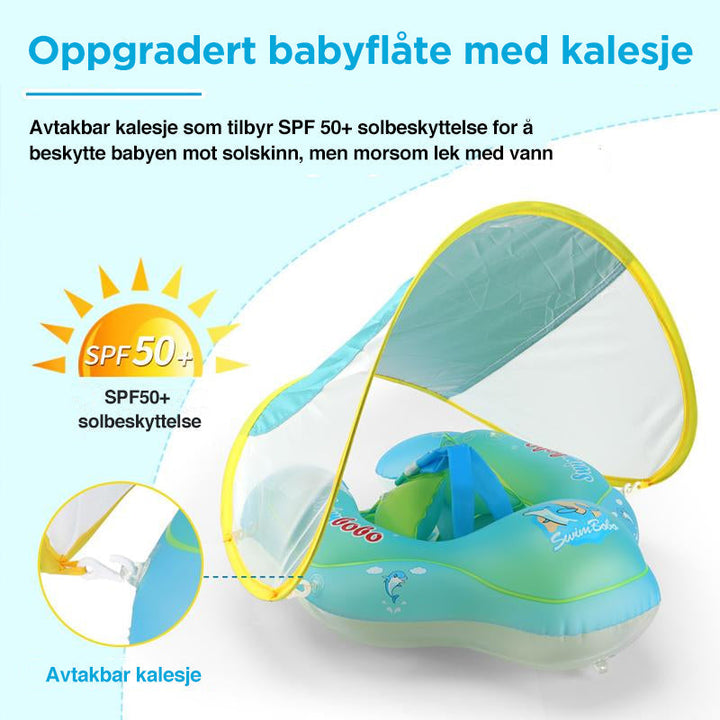 Glad baby som leker trygt i svømmeflåte med baldakin, perfekt for basseng og sommerkomfort.
