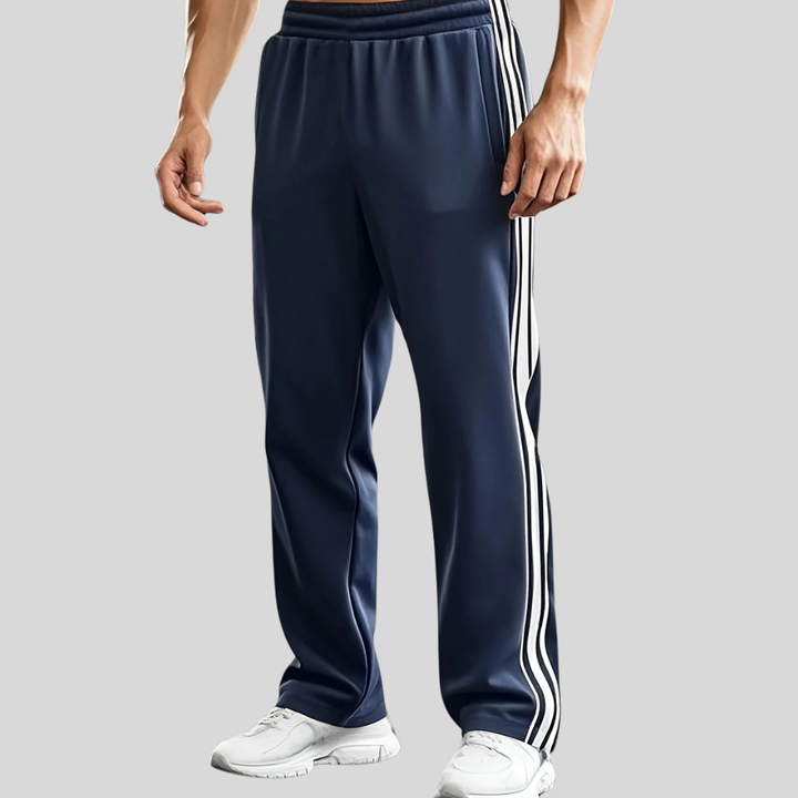 Menns pustende sportsbukser i svart for trening og fritid, med snøring og sidelommer. Komfortabel activewear.