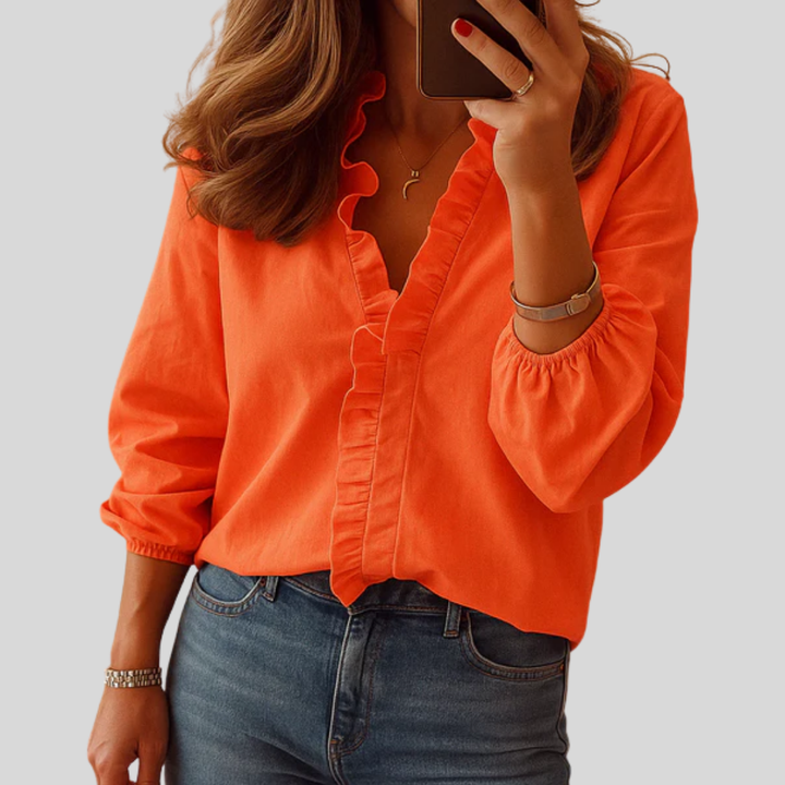 Elegant damebluse med volanger for kontor & fest. Langermet, feminin topp for en stilfull hverdag.
