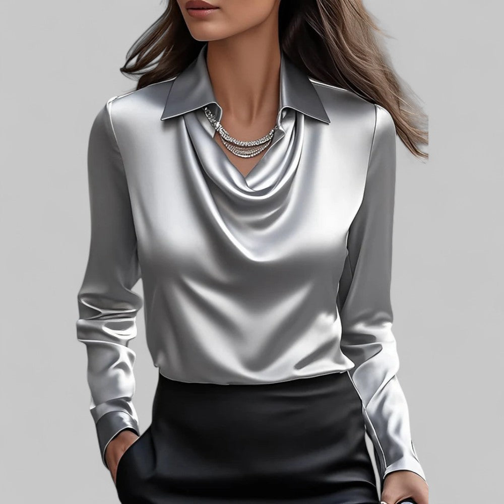 Klassisk bluse med flytende vannfall utringning. Langermet design for en sofistikert look.