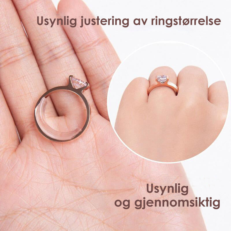Nærbilde av gjennomsiktig ringstørrelsesjusterer diskret tilpasset en ring for bedre hold og passform.