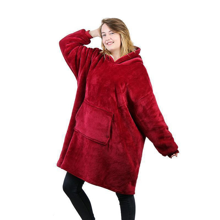Komfortabelt bærbart teppe med hette, perfekt som koselig loungewear for kvinner.