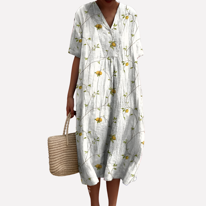 Feminin V-hals kjole med blomstermønster og korte ermer. En trendy sommerkjole for kvinner.