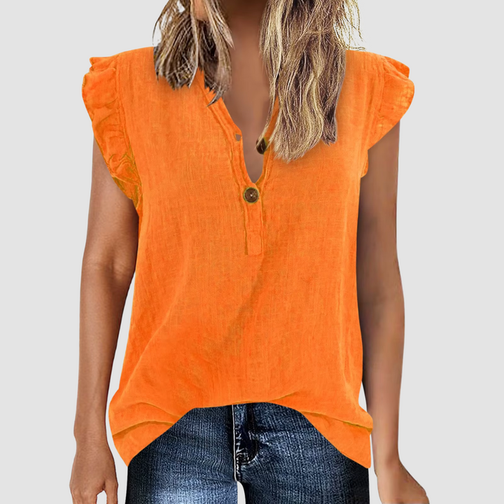 Ny, komfortabel damebluse med V-hals og løs passform. Perfekt sommerbluse for moderne kvinnemote. Lange ermer.